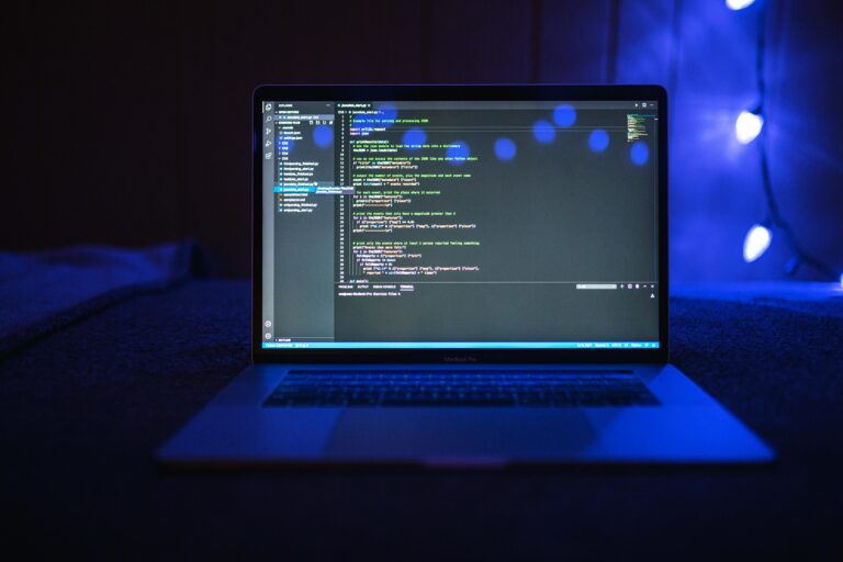 A laptop computer screen filled with detailed computer code, representing the behind-the-scenes work involved in creating digital products and applications.