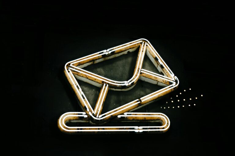 Ethereal correspondence: A minimalist, neon-lit depiction of a letter or envelope, evoking a sense of digital, otherworldly communication.