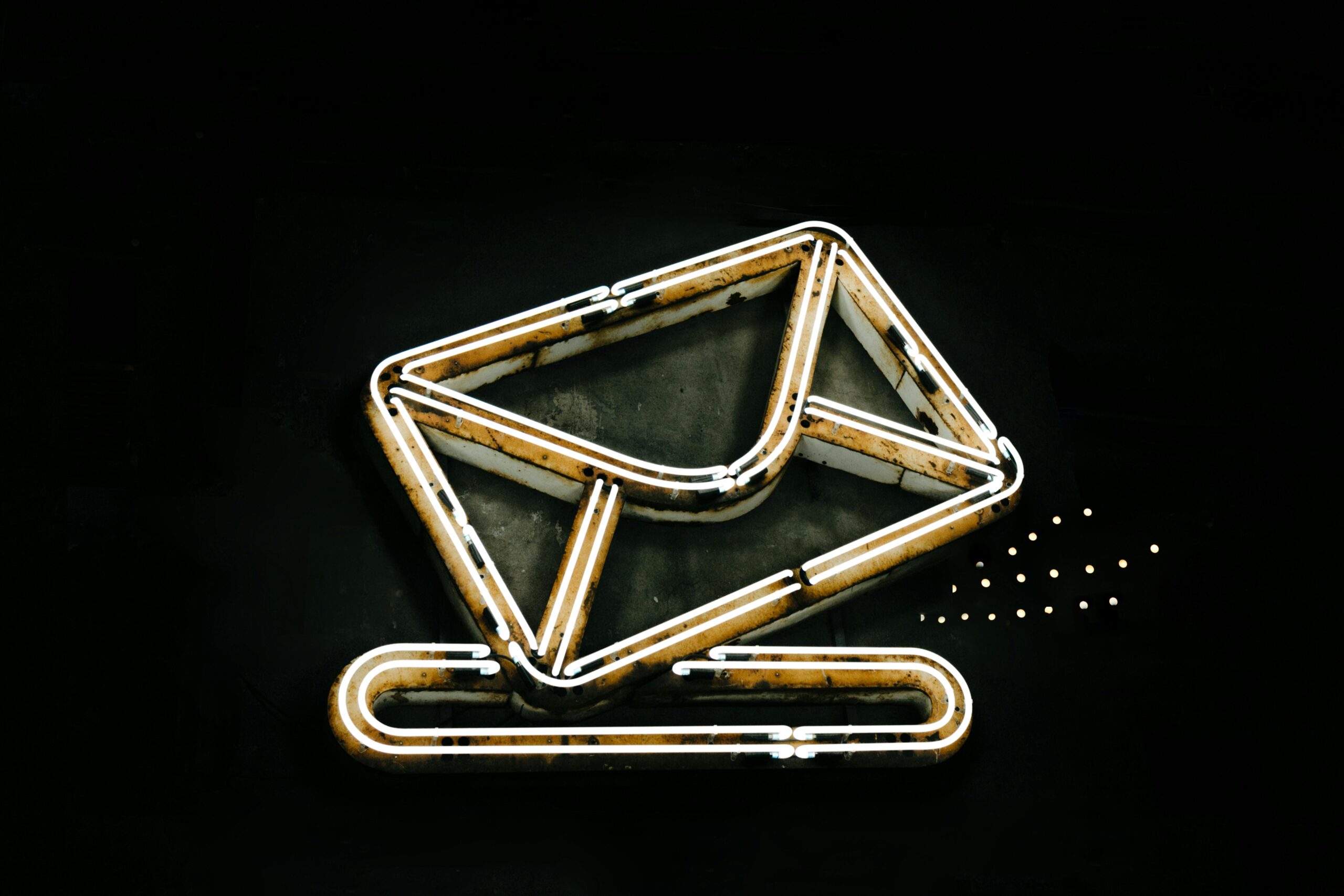 Ethereal correspondence: A minimalist, neon-lit depiction of a letter or envelope, evoking a sense of digital, otherworldly communication.
