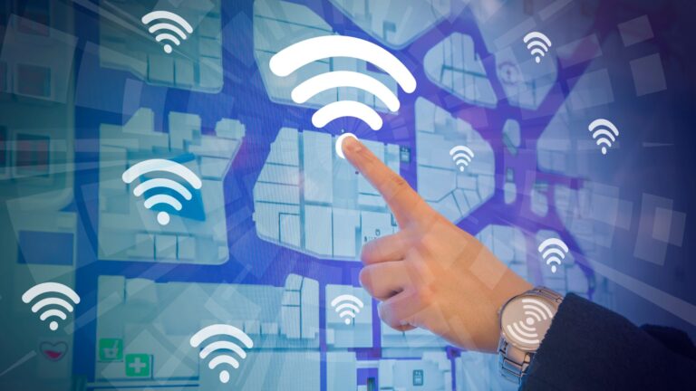 A close-up view of a hand pointing at a Wi-Fi symbol, emphasizing the focus on wireless communication and internet access.