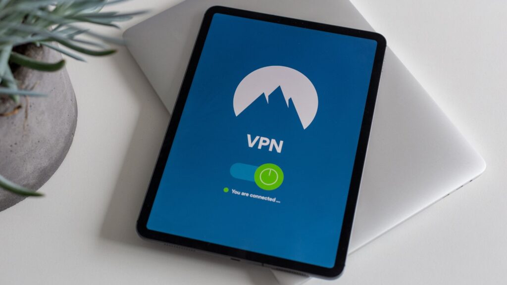 A tablet device displaying a VPN connection screen, with a green indicator light signifying the user is connected.
