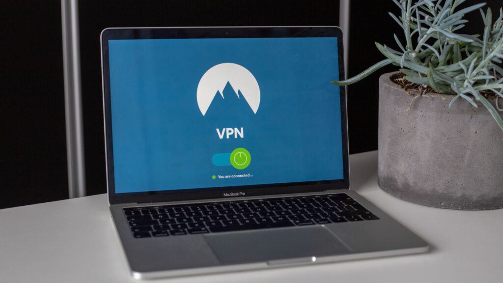 A laptop computer screen displaying the VPN connection screen, indicating secure connections across different environments.