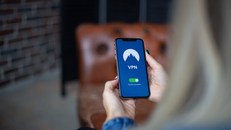 A smartphone device displaying the VPN connection screen, with a green indicator light showing the user is connected.